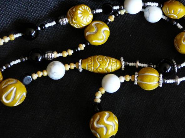 Carved black jade, yellow south African trading beads, onyx